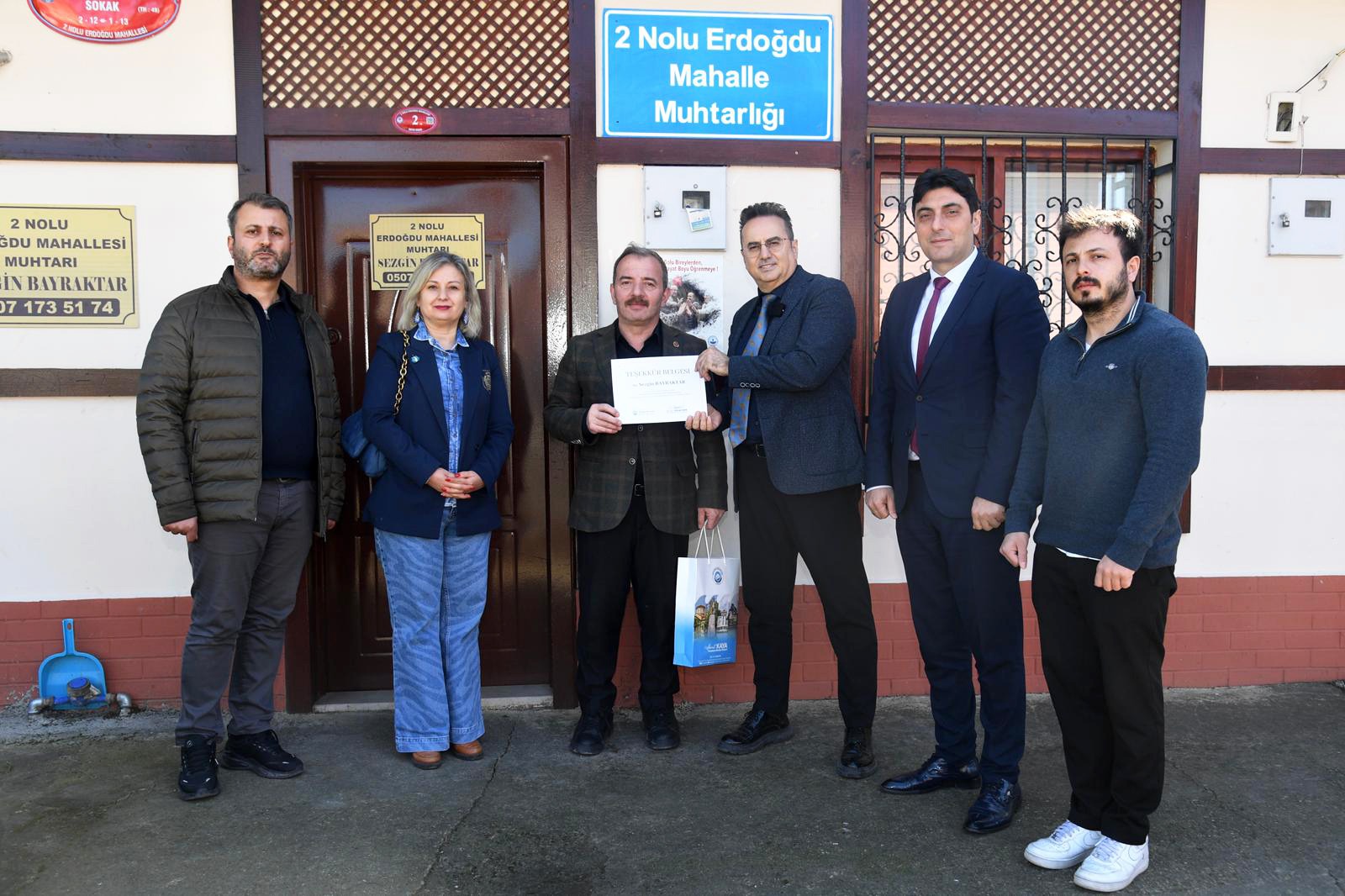 GER� D�N���MDE FARKINDALIK OLU�TURAN MUHTARLARA TE�EKK�R BELGES� VER�LD�
